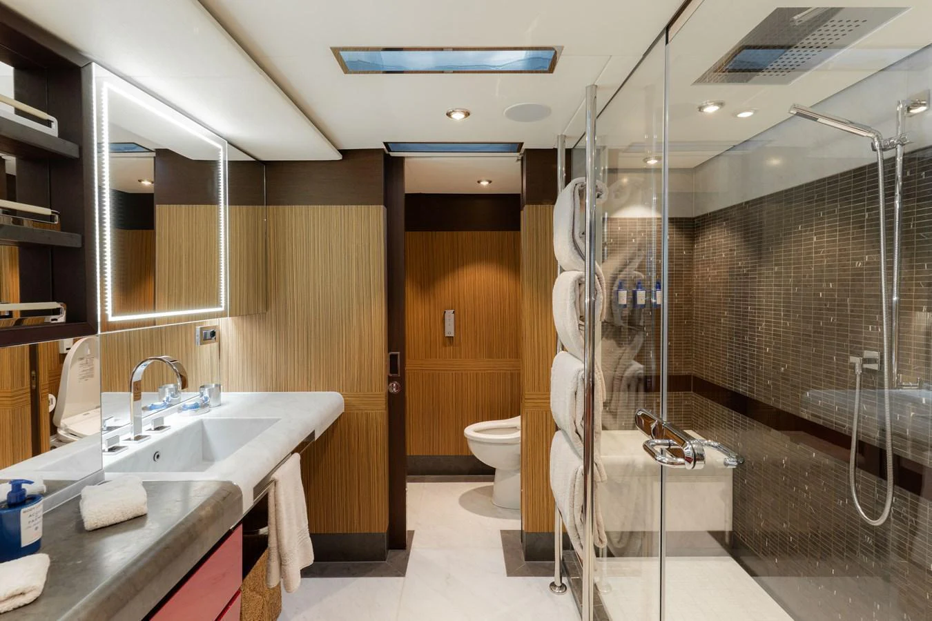 The yacht's bathroom features modern fixtures and a spacious shower area. aboard RENEGADE Yacht for Sale