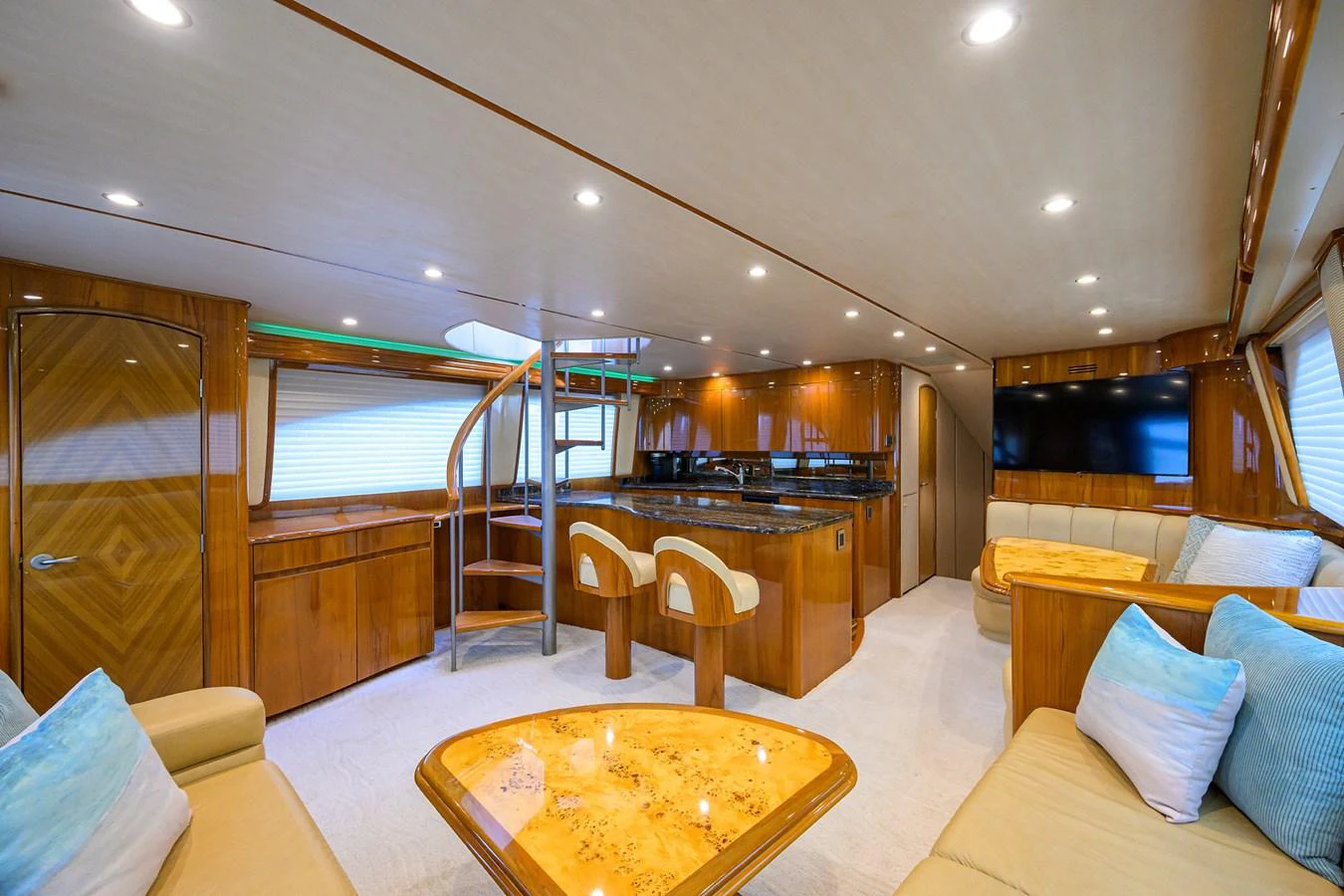 a large room with a large glass window and a table with chairs aboard MARLIN MONROE Yacht for Sale