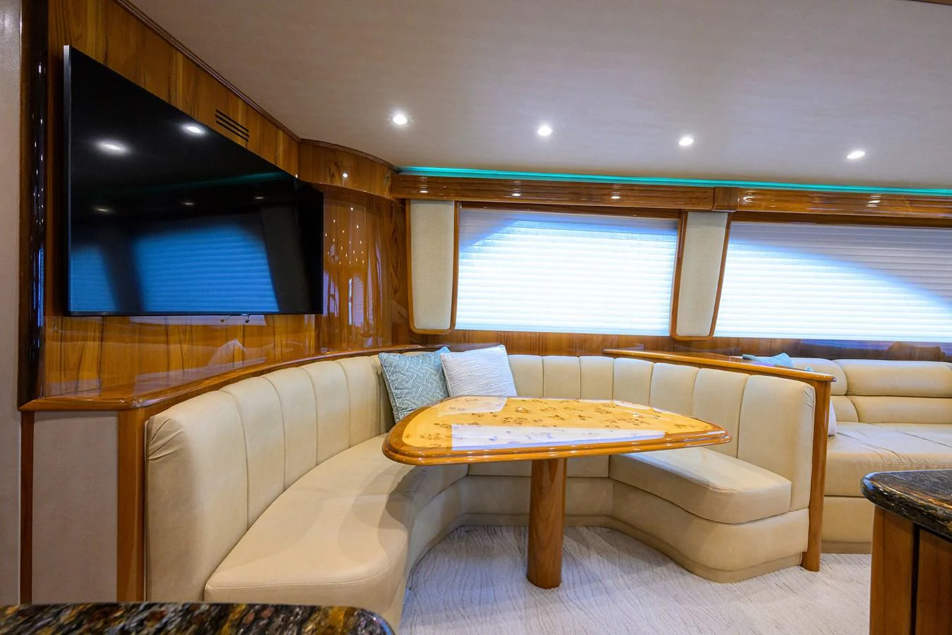 a living room with a couch and a tv aboard MARLIN MONROE Yacht for Sale