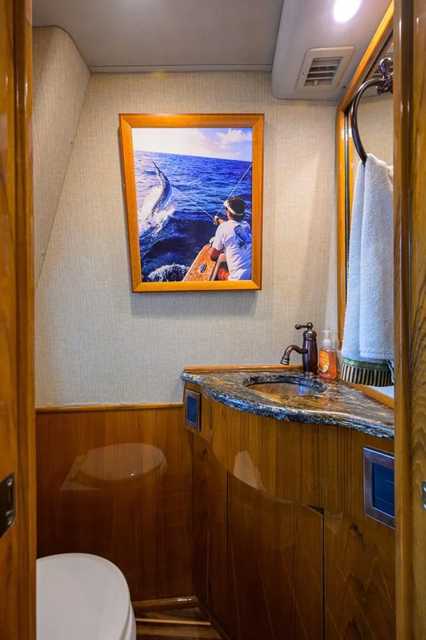 a bathroom with a painting on the wall aboard MARLIN MONROE Yacht for Sale