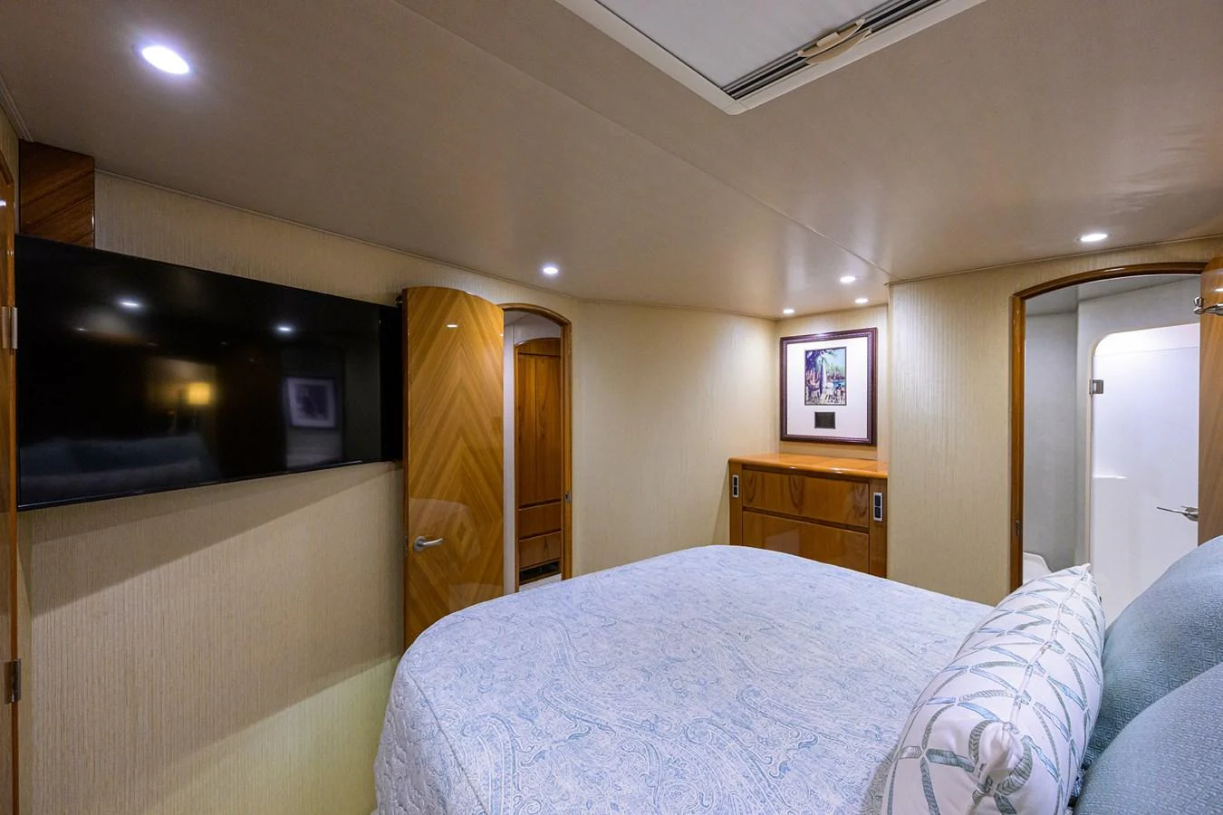 a bedroom with a bed and a television aboard MARLIN MONROE Yacht for Sale