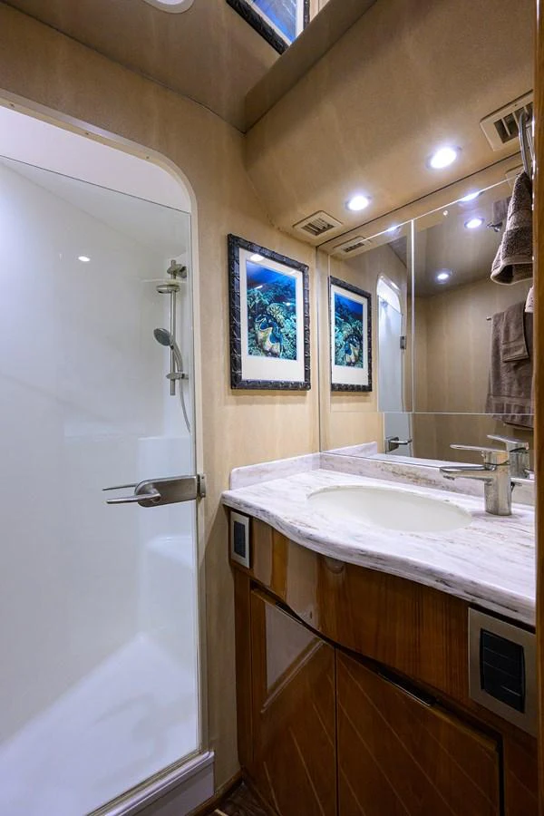 a bathroom with a sink and mirror aboard MARLIN MONROE Yacht for Sale