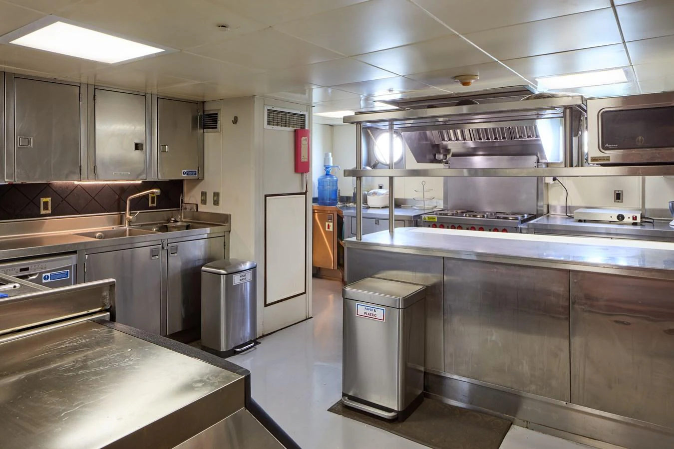 The yacht's galley is equipped with professional-grade stainless steel appliances and ample counter space. aboard GLOBAL Yacht for Sale