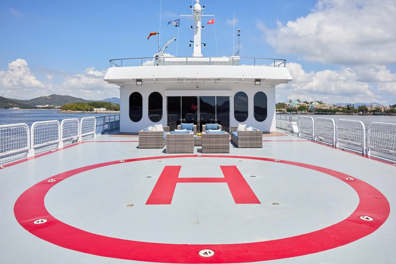 The yacht features a spacious helipad on the upper deck, offering convenience and luxury. aboard GLOBAL Yacht for Sale