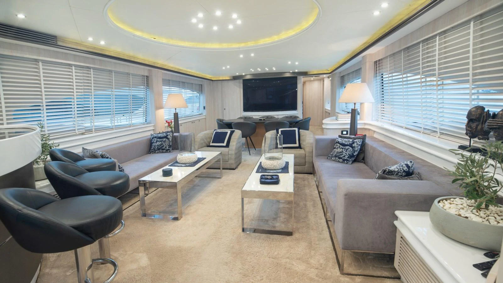 The salon features luxurious seating, modern decor, and ample natural light. aboard MI ALMA Yacht for Sale