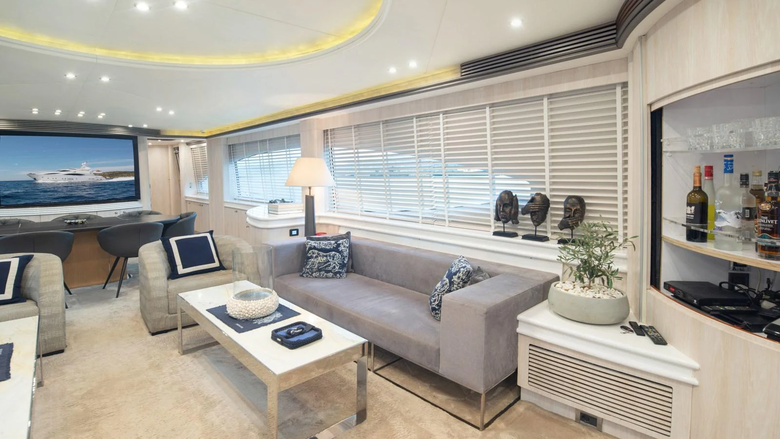 The salon features a spacious and elegant seating area with modern decor and ample natural light. aboard MI ALMA Yacht for Sale