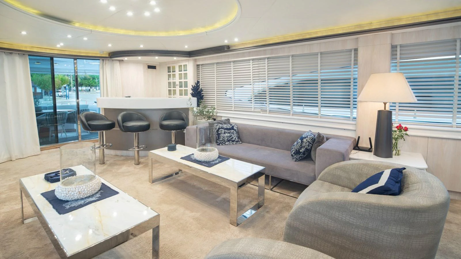 The salon features a modern and elegant design with comfortable seating and a stylish bar area. aboard MI ALMA Yacht for Sale