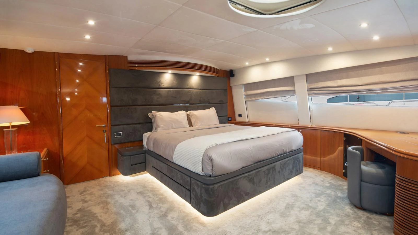 The master stateroom features a luxurious bed with elegant lighting and modern furnishings. aboard MI ALMA Yacht for Sale