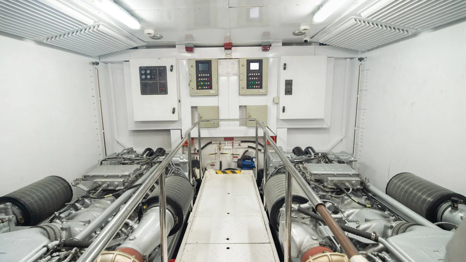 The image showcases the pristine engine room of the yacht, highlighting its advanced machinery and clean layout. aboard MI ALMA Yacht for Sale