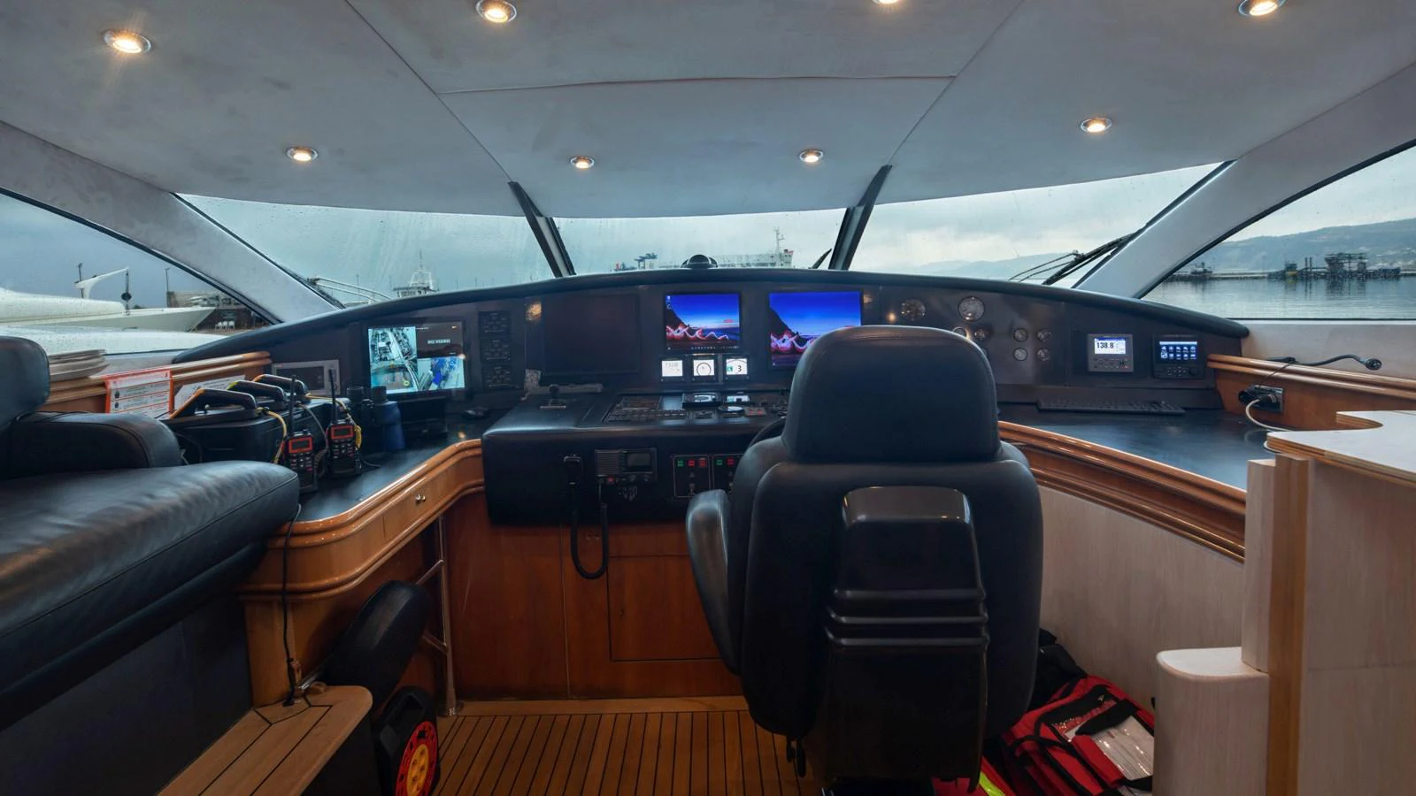 The helm station features advanced navigation equipment and a comfortable captain's chair, offering a commanding view for smooth sailing. aboard MI ALMA Yacht for Sale