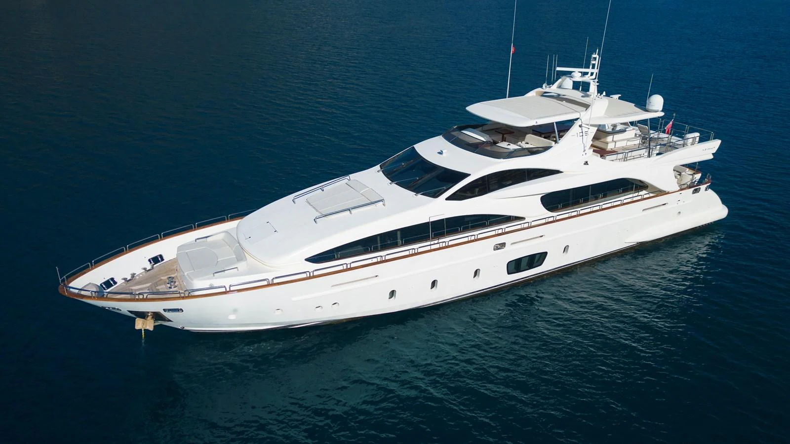 a white yacht in the water aboard LA RUBIA Yacht for Sale