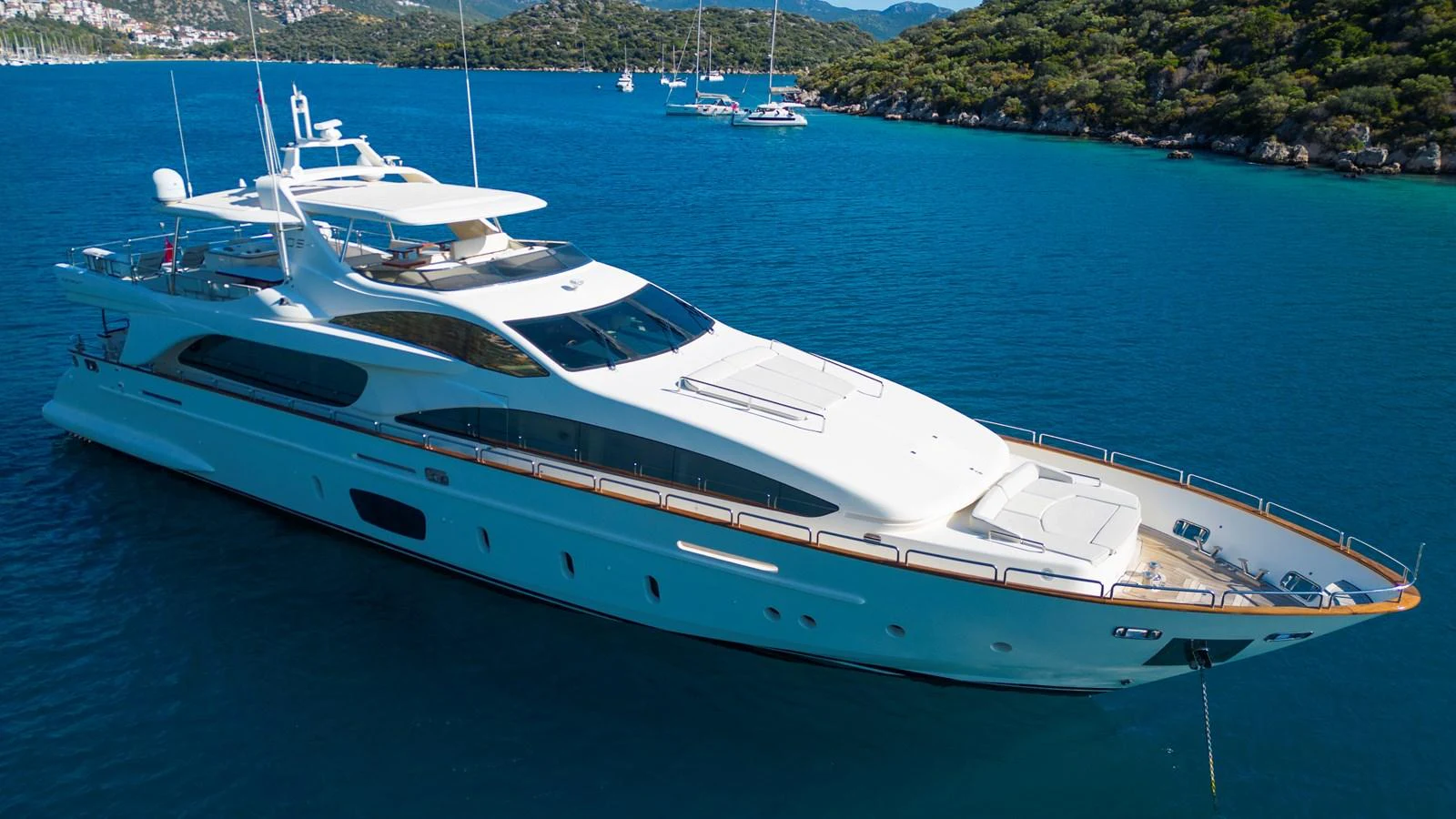 a white yacht in the water aboard LA RUBIA Yacht for Sale