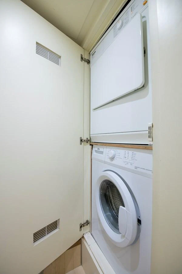 a white washing machine aboard LA RUBIA Yacht for Sale