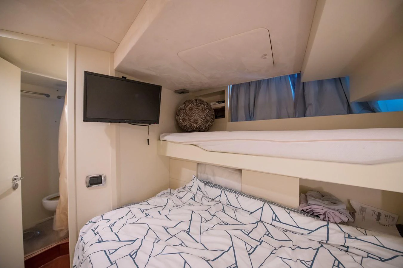 a tv on a wall aboard LA RUBIA Yacht for Sale