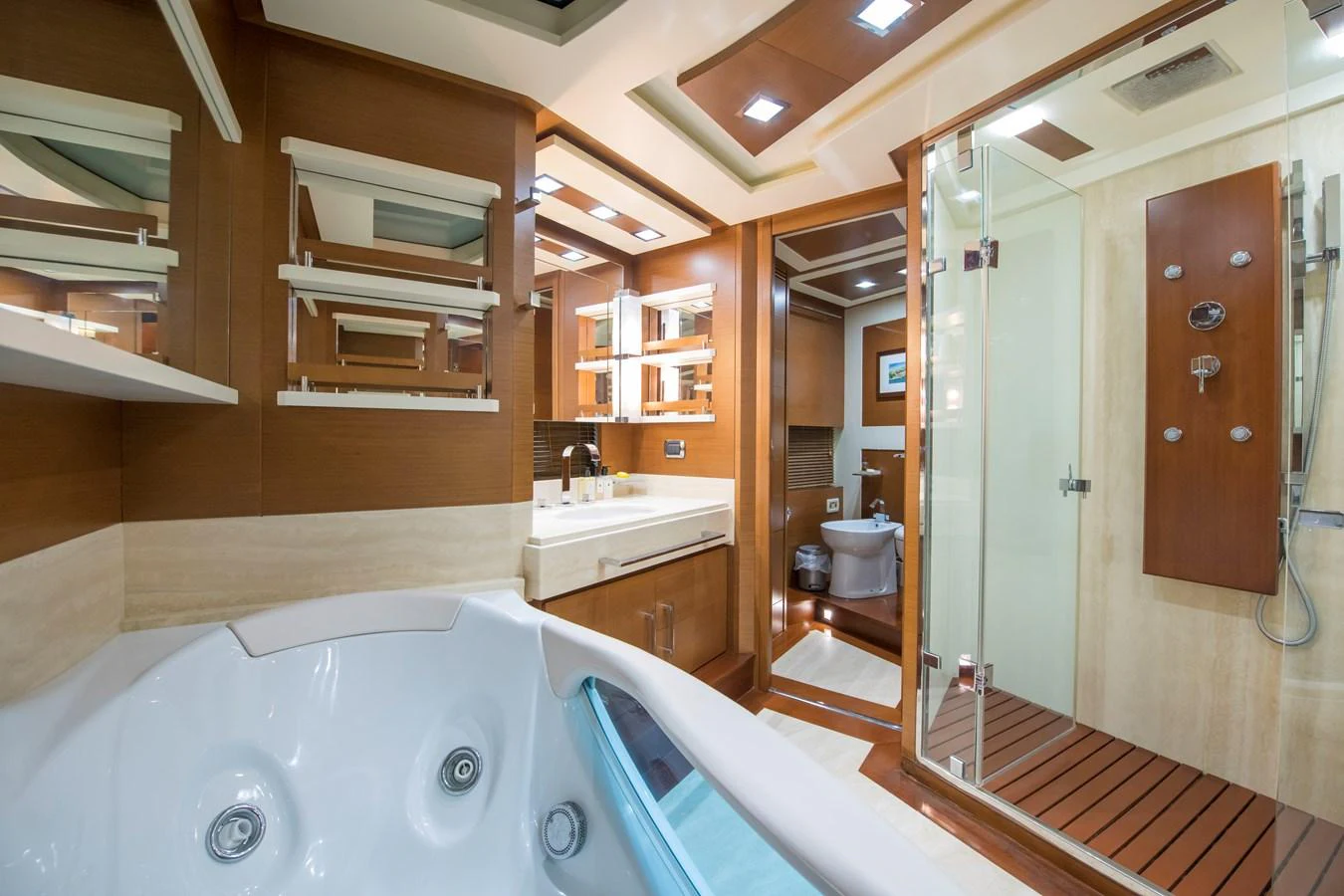 a bathroom with a tub and a sink aboard LA RUBIA Yacht for Sale