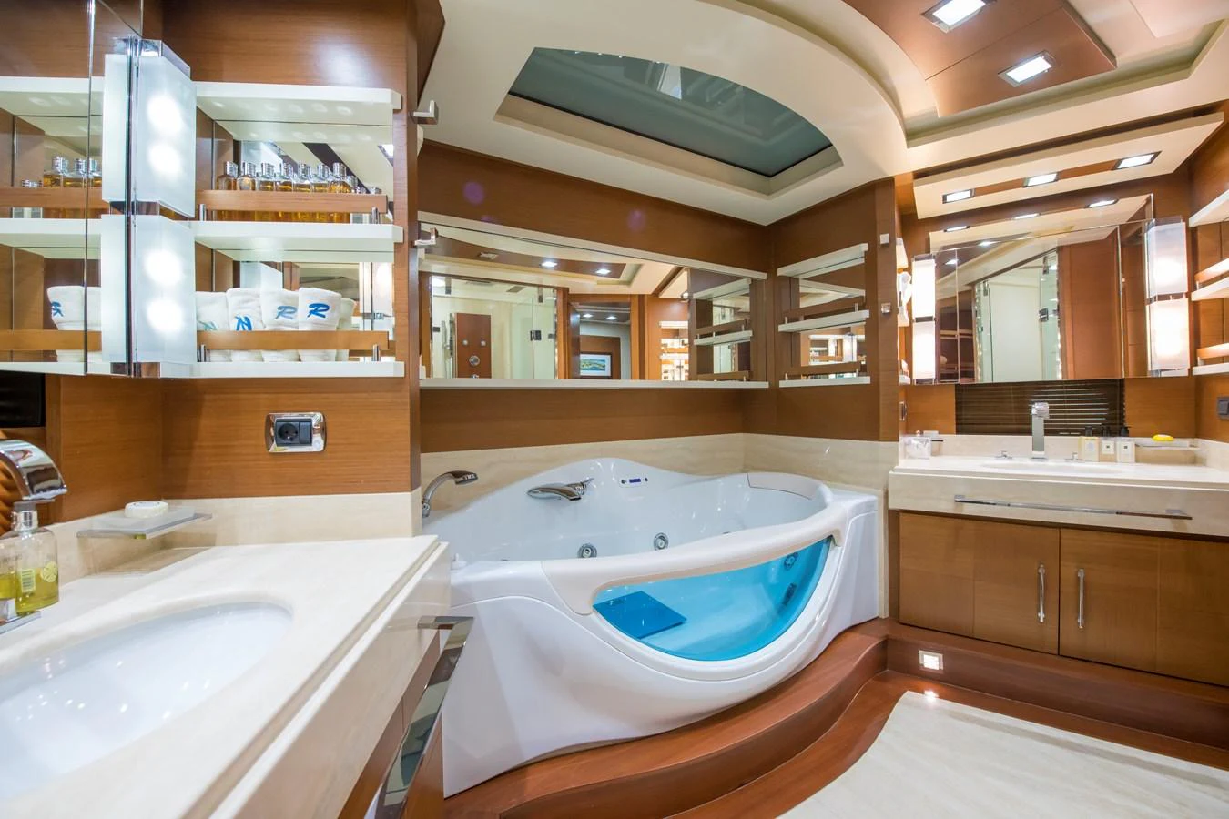 a bathroom with a tub sink and cabinets aboard LA RUBIA Yacht for Sale