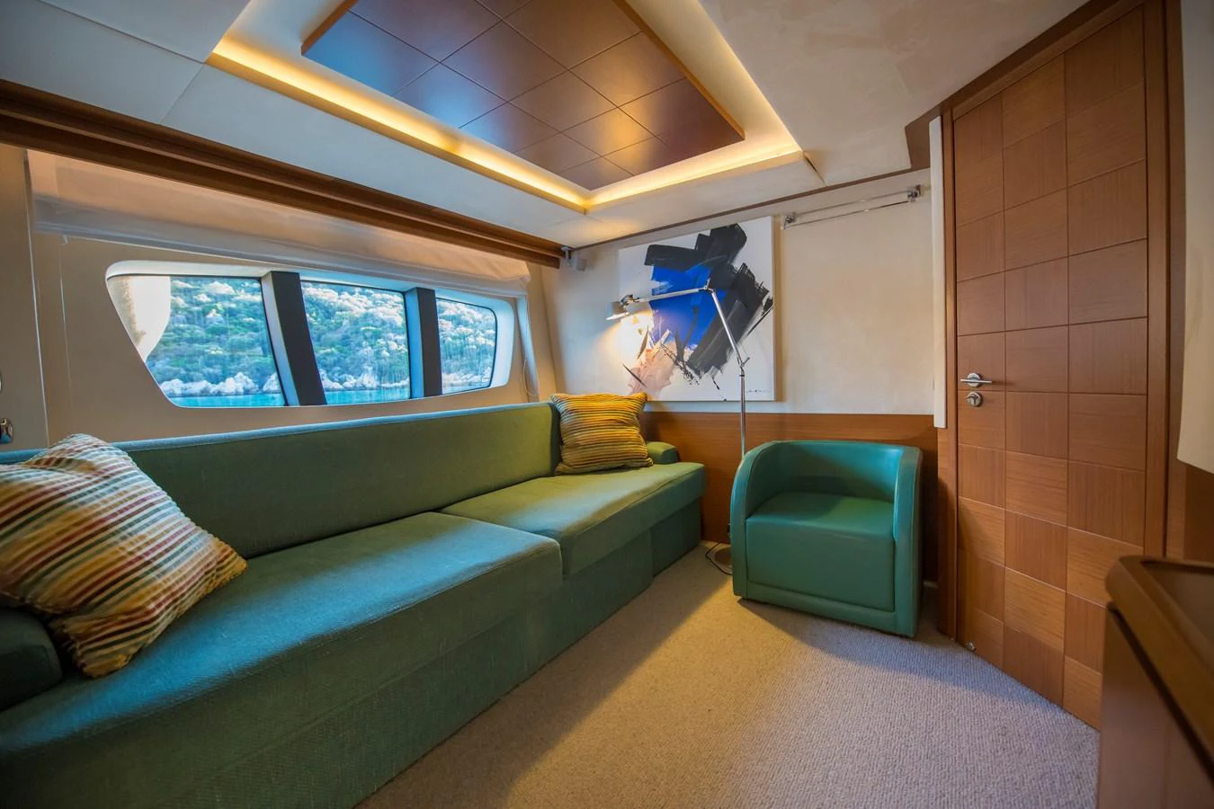 a room with a couch and a chair aboard LA RUBIA Yacht for Sale