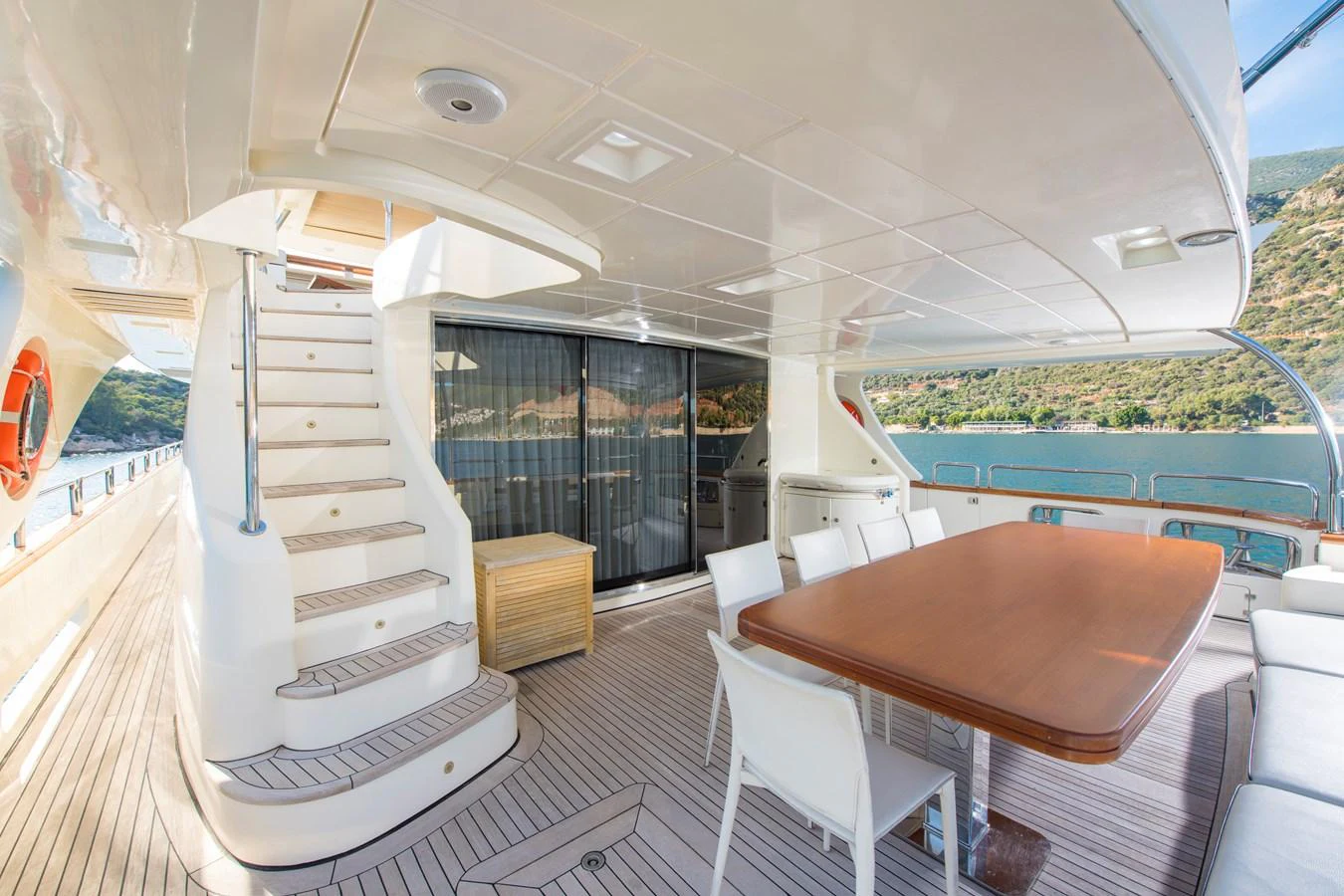 a room with a table and chairs aboard LA RUBIA Yacht for Sale