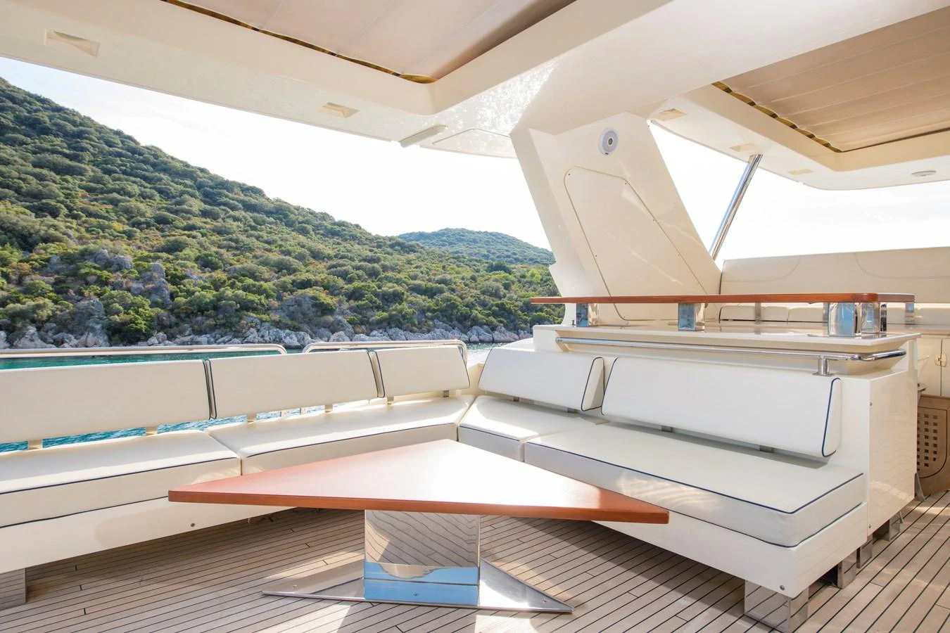 a room with a view of a mountain and trees aboard LA RUBIA Yacht for Sale