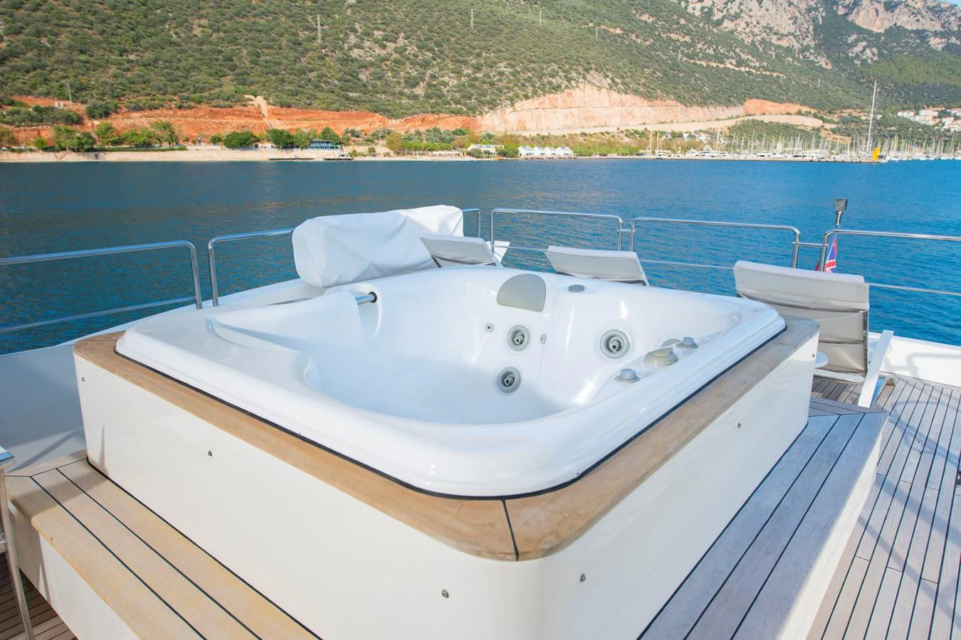 a white boat on a dock aboard LA RUBIA Yacht for Sale