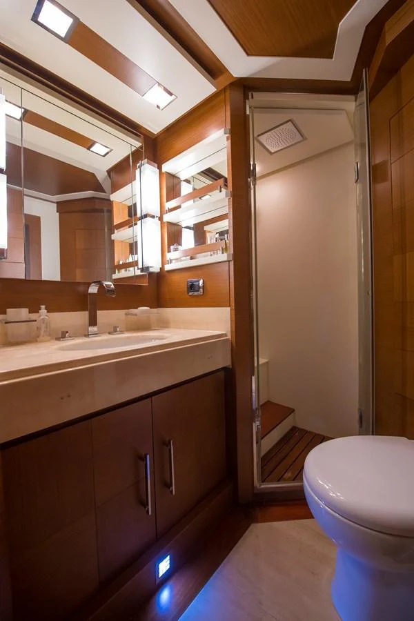 a bathroom with a sink and a toilet aboard LA RUBIA Yacht for Sale