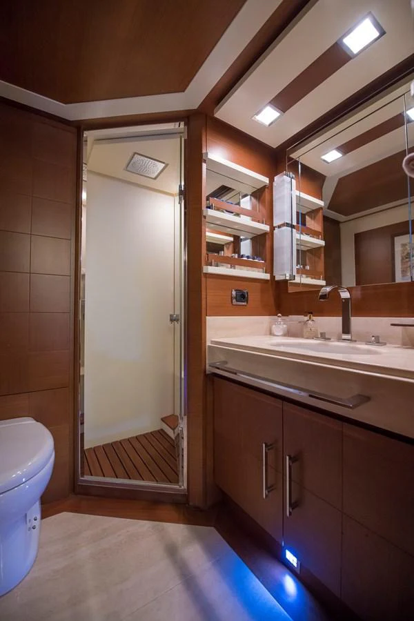 a bathroom with a glass shower aboard LA RUBIA Yacht for Sale