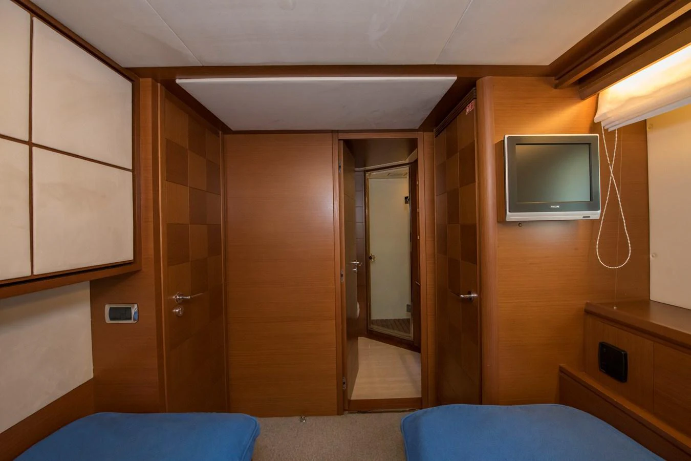 a room with a tv and a bed aboard LA RUBIA Yacht for Sale