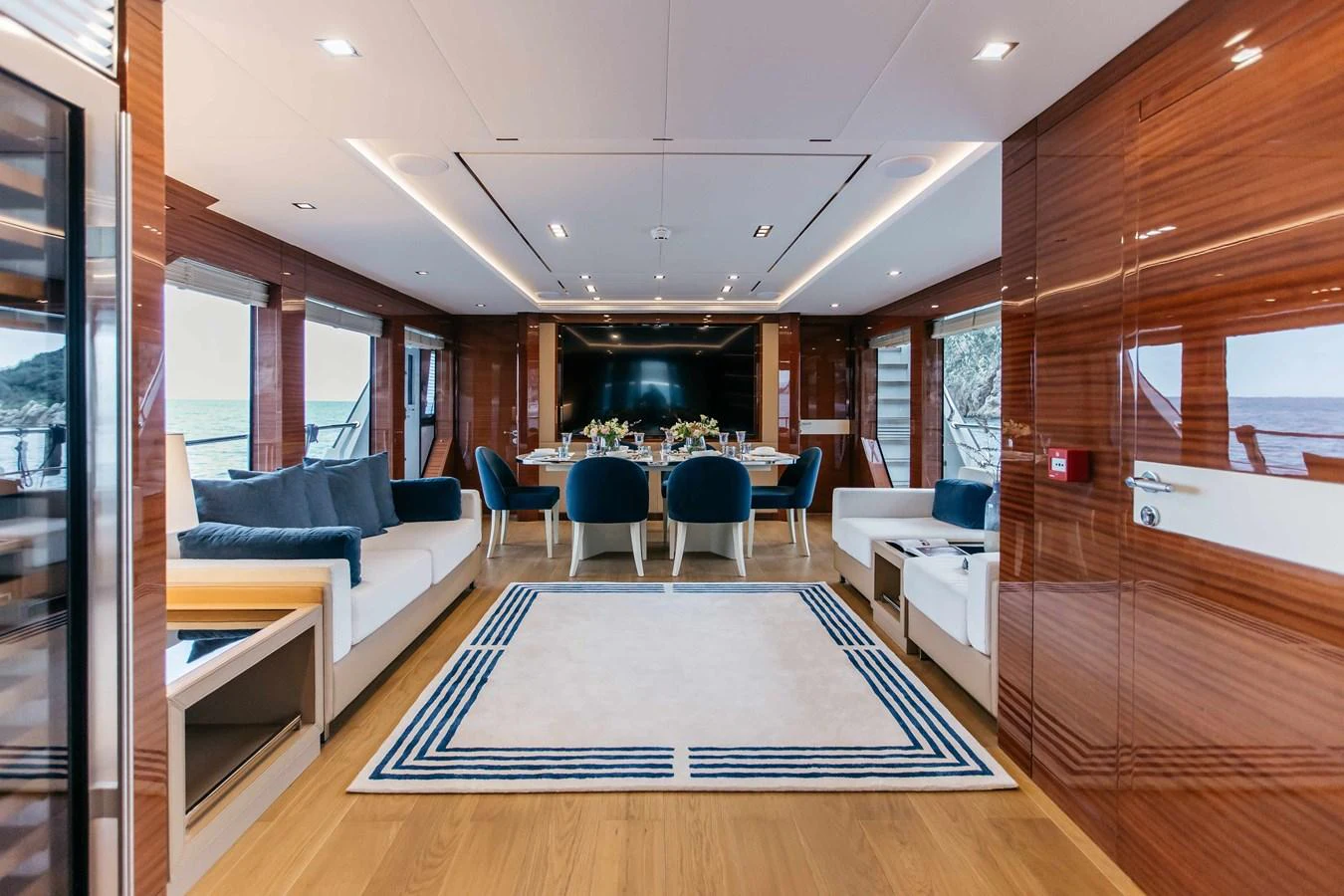 a room with a table and chairs aboard PAPILLON Yacht for Sale