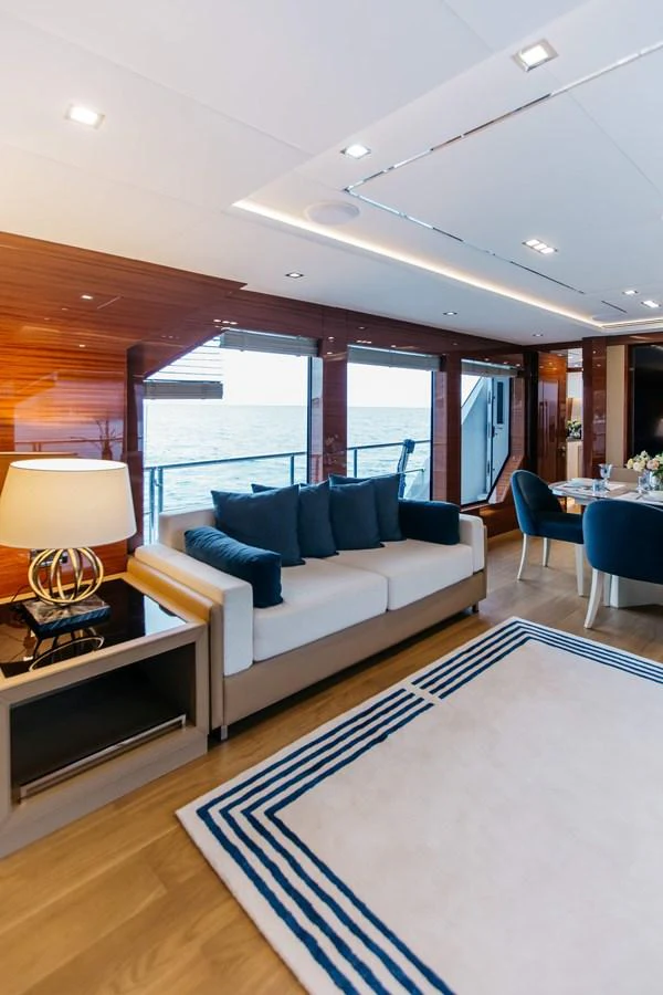 a living room with a couch and a table aboard PAPILLON Yacht for Sale