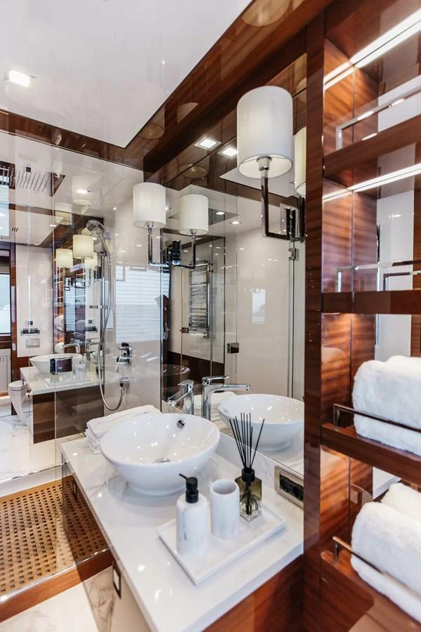 a bathroom with a large mirror aboard PAPILLON Yacht for Sale