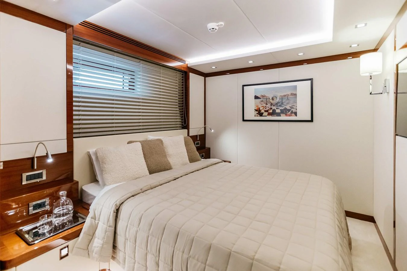 a bedroom with a bed and a window aboard PAPILLON Yacht for Sale