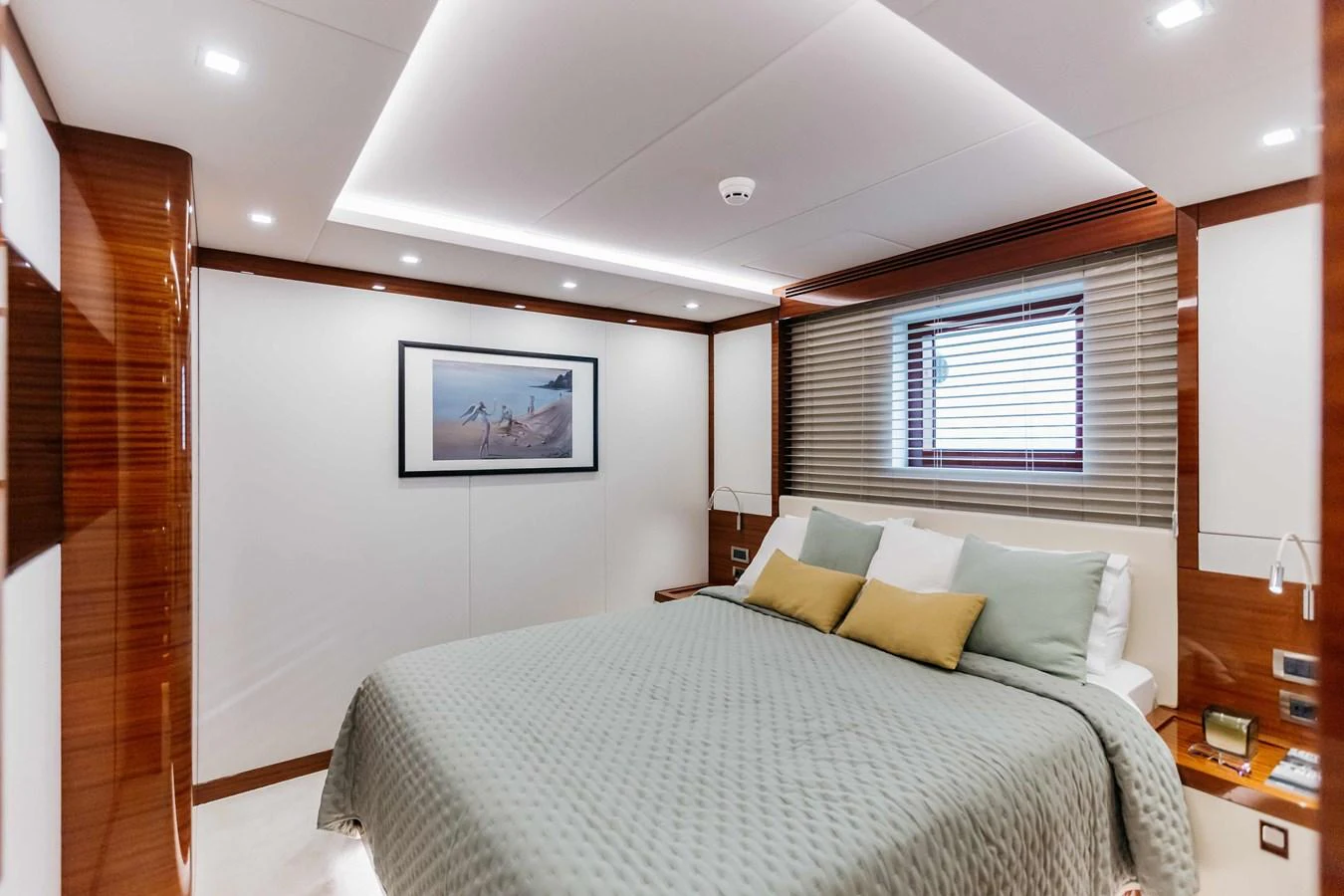 a bedroom with a bed and a window aboard PAPILLON Yacht for Sale