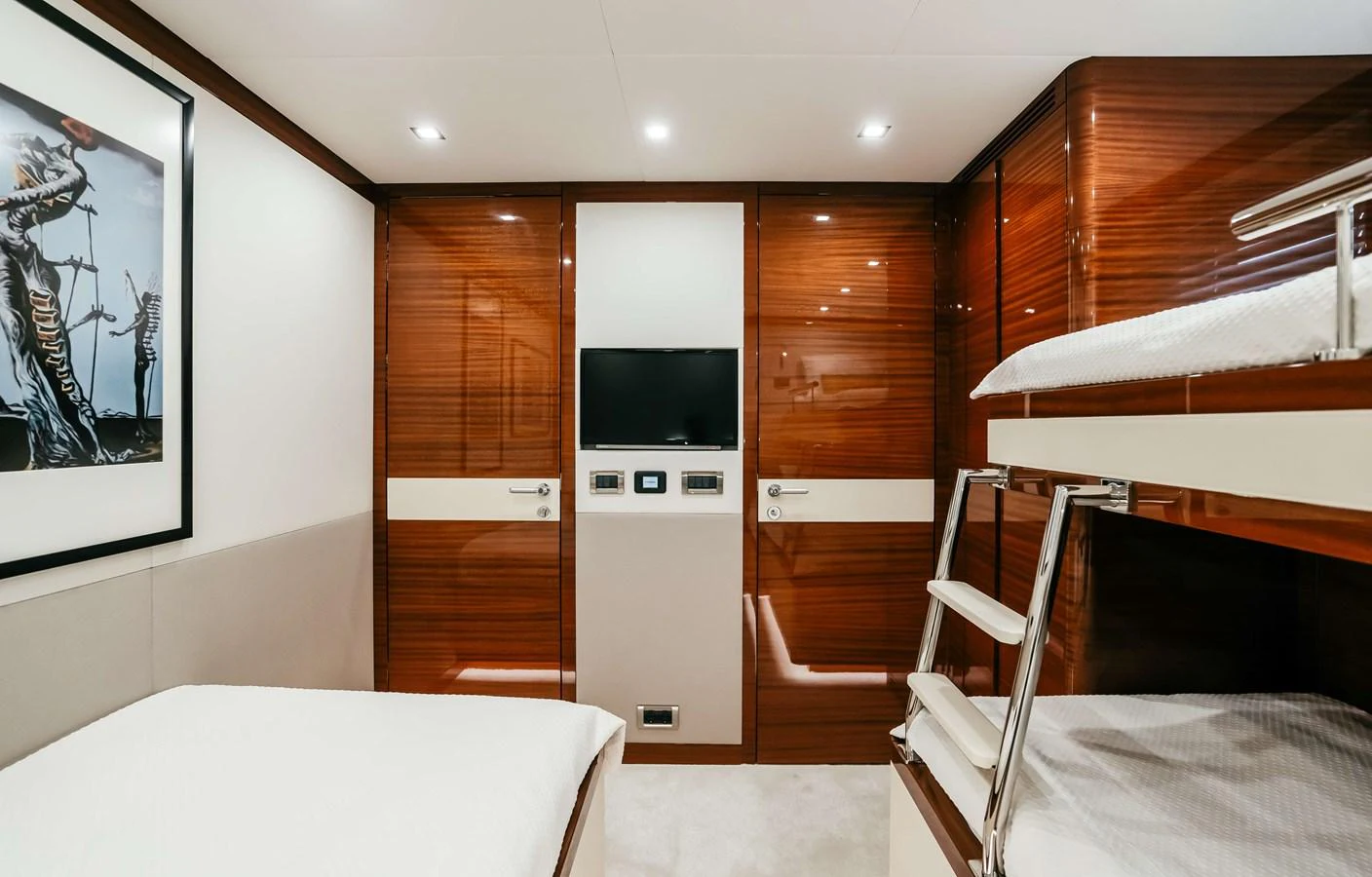 a room with bunk beds and a tv aboard PAPILLON Yacht for Sale