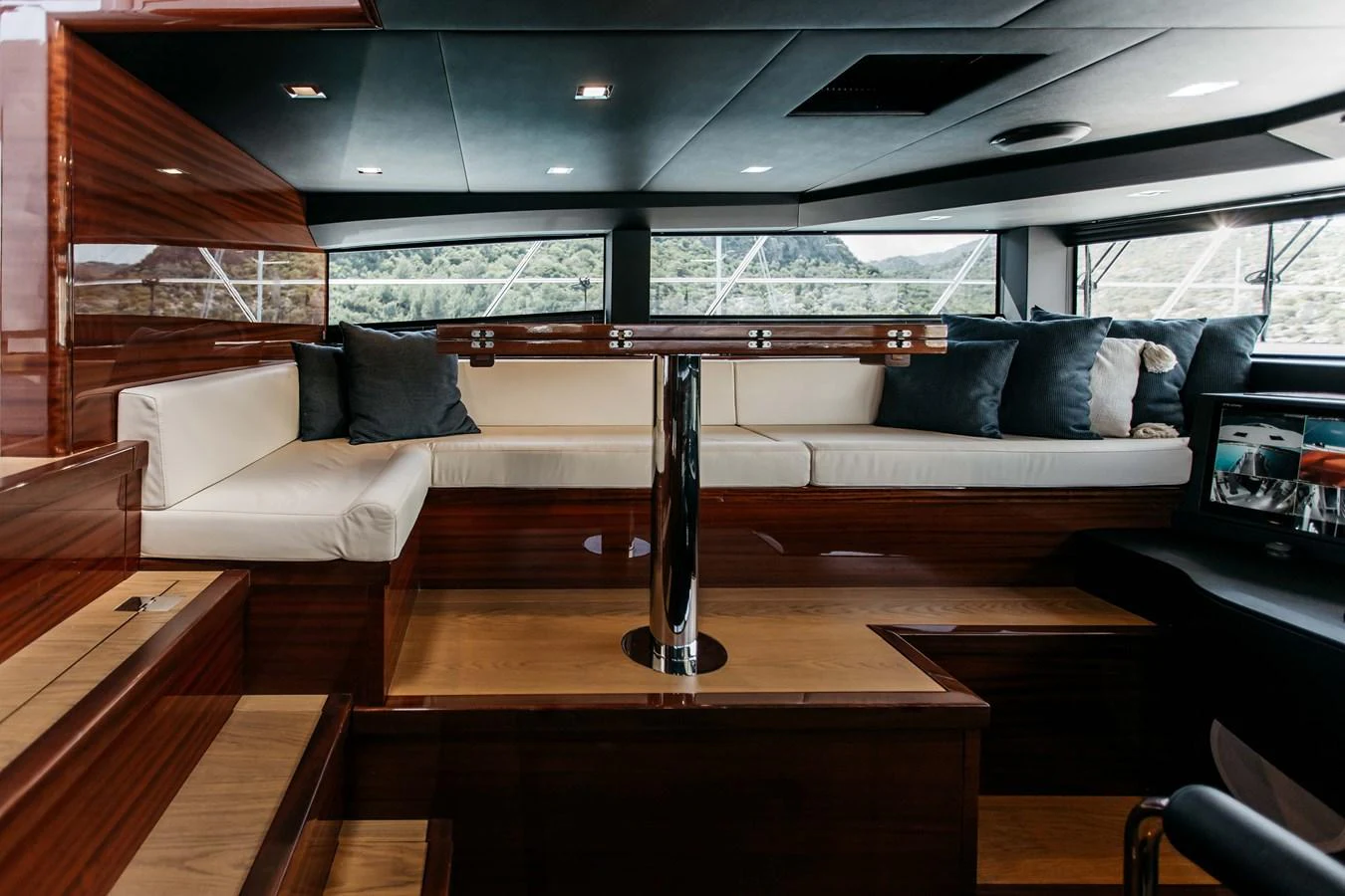 a room with a couch and a table aboard PAPILLON Yacht for Sale