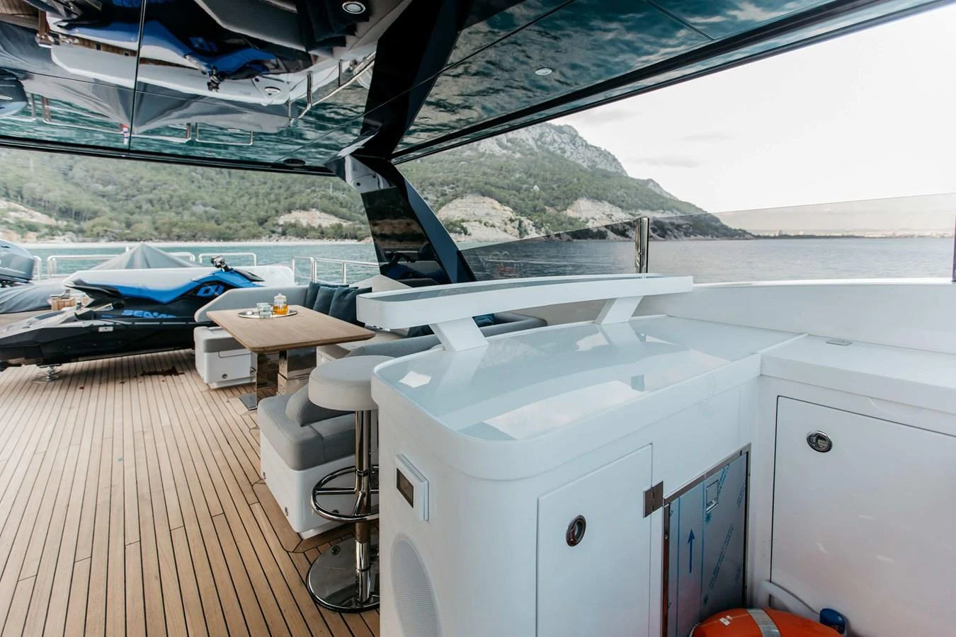 a deck with a boat and a dock aboard PAPILLON Yacht for Sale