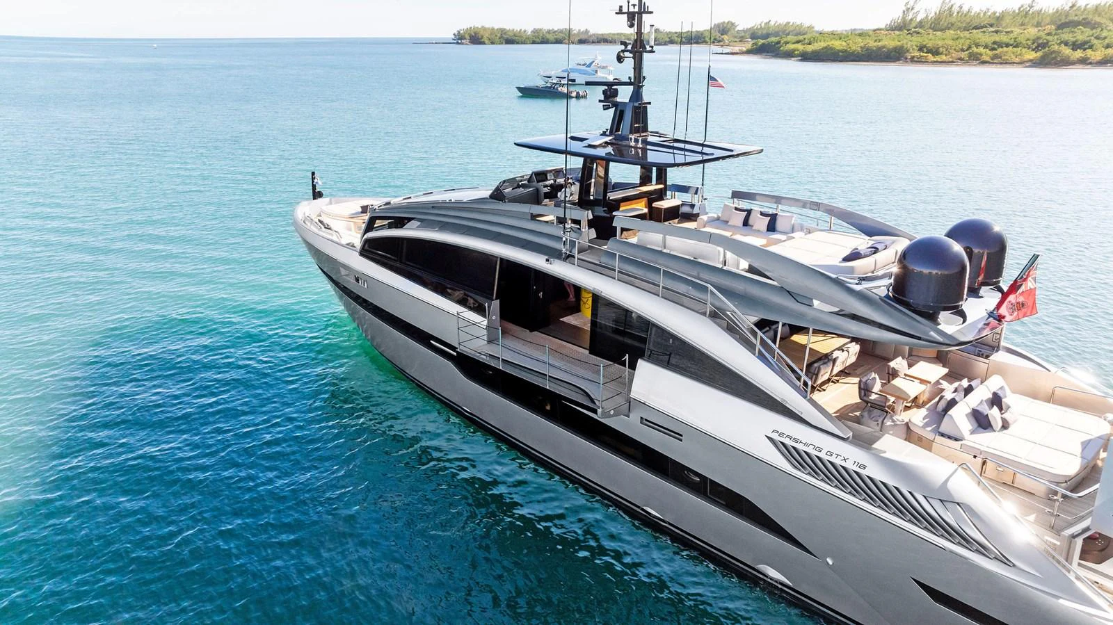A sleek and modern yacht glides gracefully on clear blue waters, showcasing its luxurious design and spacious deck areas. aboard CAFFEINE Yacht for Sale