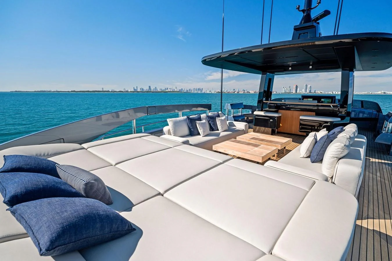 The sundeck offers luxurious lounging with plush seating and stunning ocean views. aboard CAFFEINE Yacht for Sale