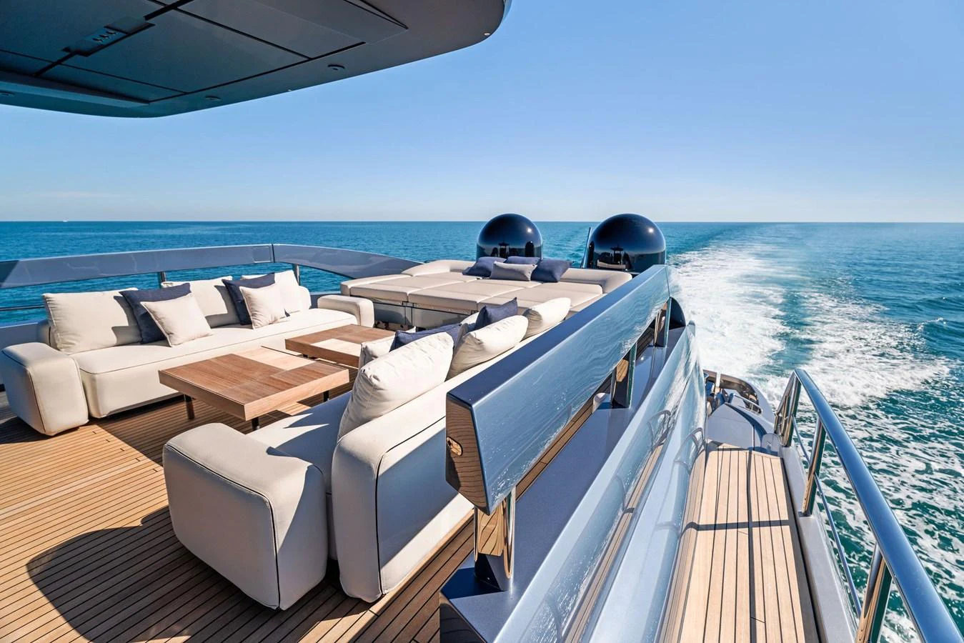 The sundeck offers luxurious lounging with expansive ocean views. aboard CAFFEINE Yacht for Sale
