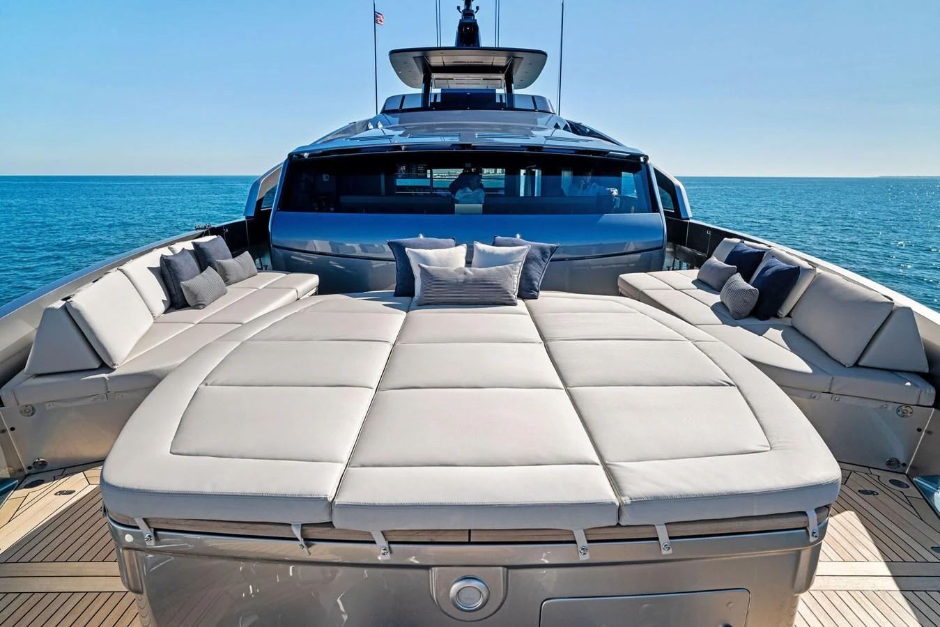 The foredeck features luxurious sun pads and ample seating, perfect for relaxation. aboard CAFFEINE Yacht for Sale