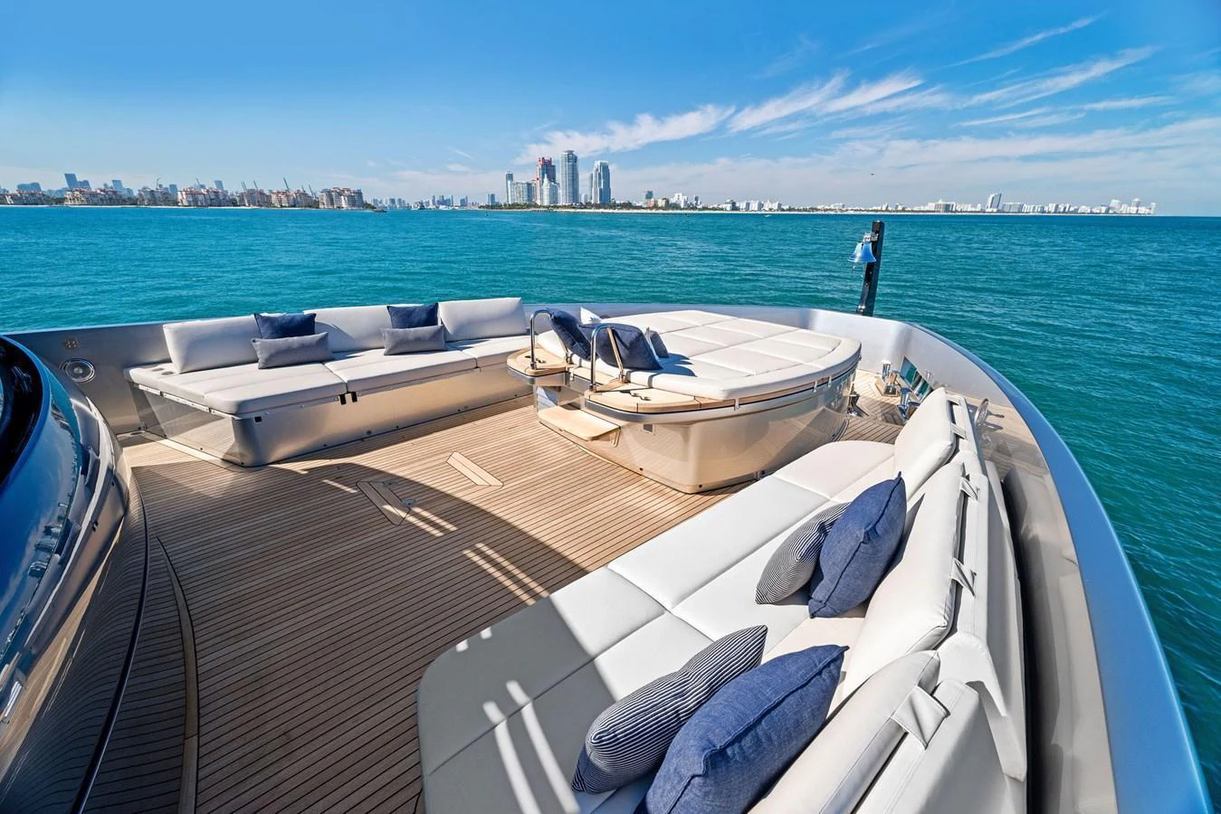 The foredeck offers spacious seating with plush cushions and stunning views of the surrounding waters. aboard CAFFEINE Yacht for Sale
