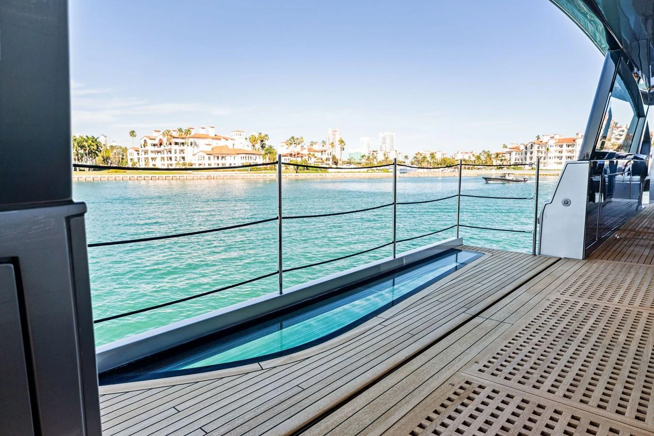 The aft deck offers a serene view of the surrounding waters and nearby coastline. aboard CAFFEINE Yacht for Sale