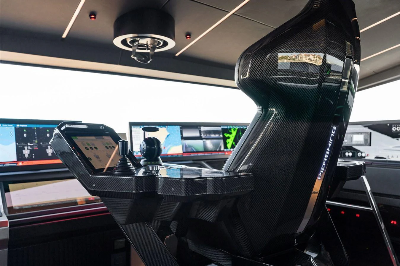 The helm station features advanced navigation equipment and a sleek, modern design. aboard CAFFEINE Yacht for Sale