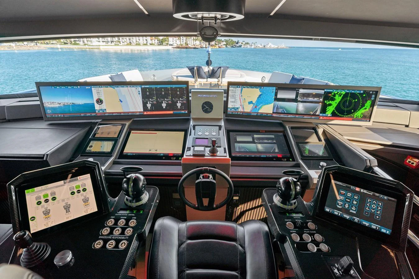 The helm station features advanced navigation and control systems with panoramic views of the surrounding waters. aboard CAFFEINE Yacht for Sale