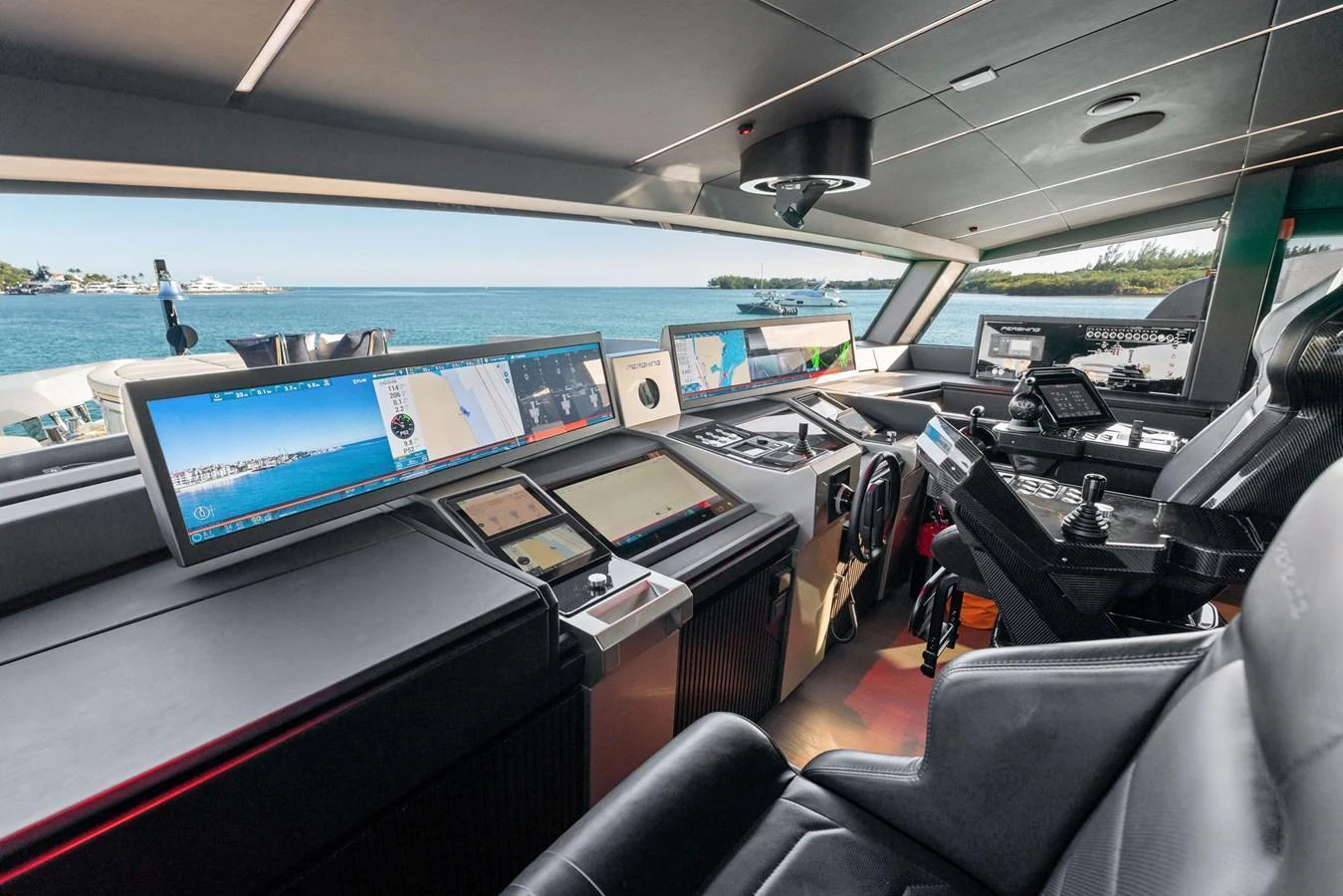The helm station offers a state-of-the-art navigation experience with panoramic views of the sea. aboard CAFFEINE Yacht for Sale