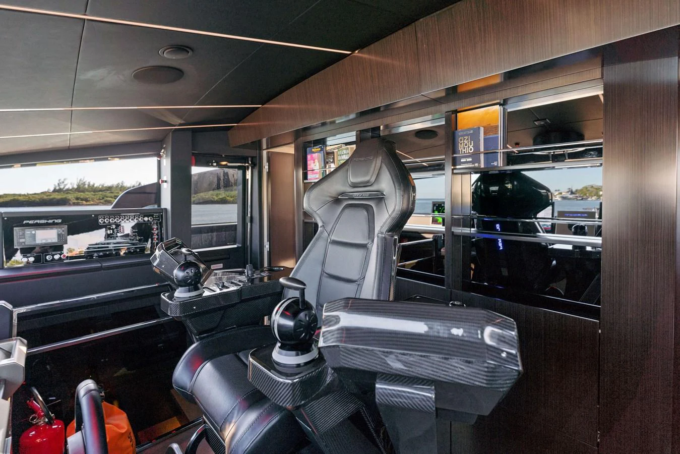 The helm station features advanced navigation equipment and a sleek, modern design. aboard CAFFEINE Yacht for Sale