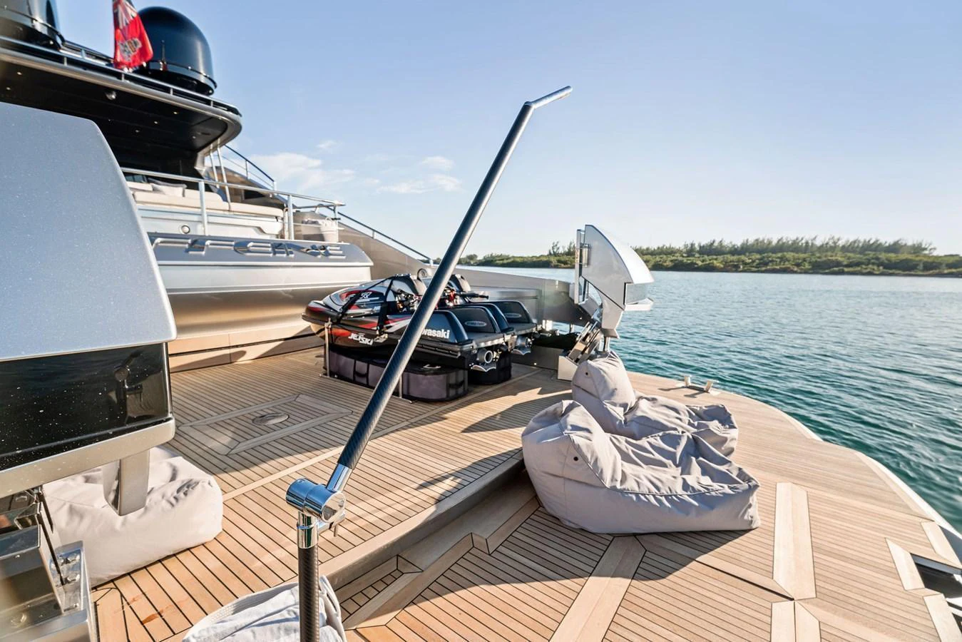 The aft deck features a spacious lounging area with bean bags and water toys, perfect for relaxation and fun. aboard CAFFEINE Yacht for Sale