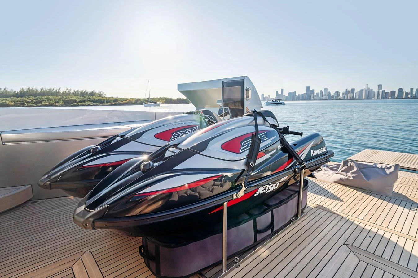 The yacht features a pair of sleek jet skis on the deck, ready for thrilling water adventures. aboard CAFFEINE Yacht for Sale