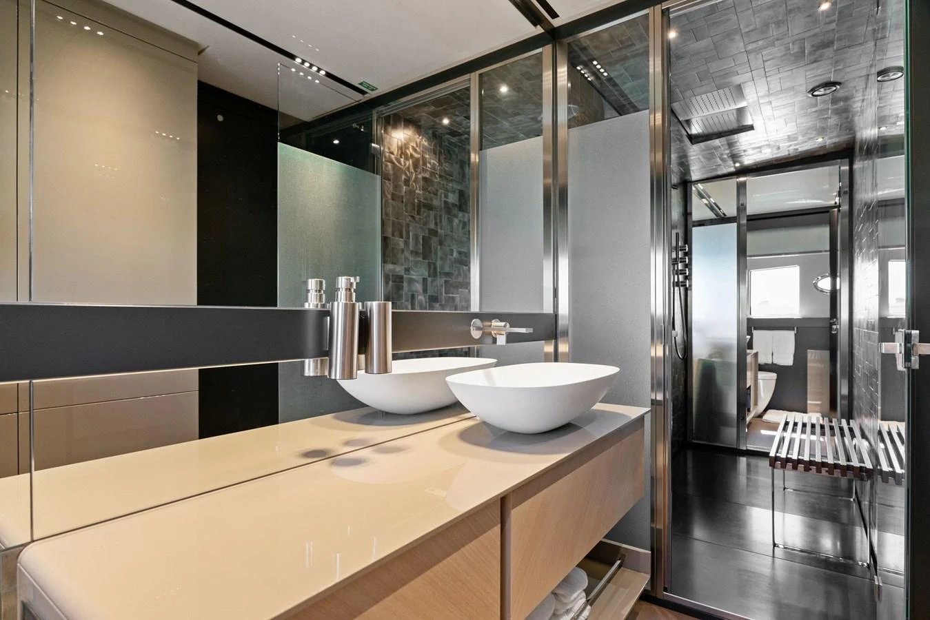 The yacht's bathroom features modern fixtures and a sleek design with ample natural light. aboard CAFFEINE Yacht for Sale