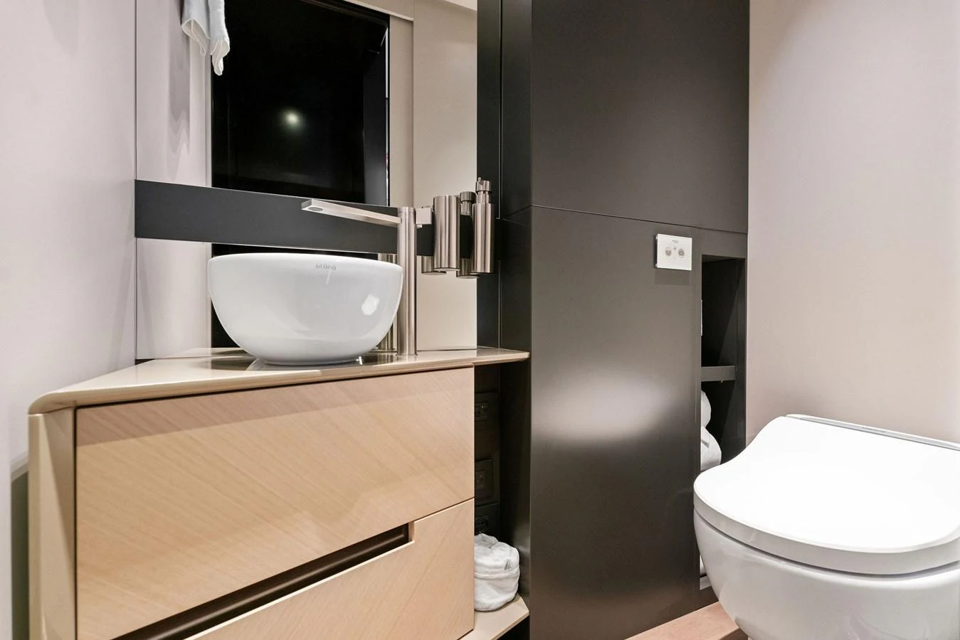 A sleek and modern yacht bathroom with contemporary fixtures and ample storage. aboard CAFFEINE Yacht for Sale