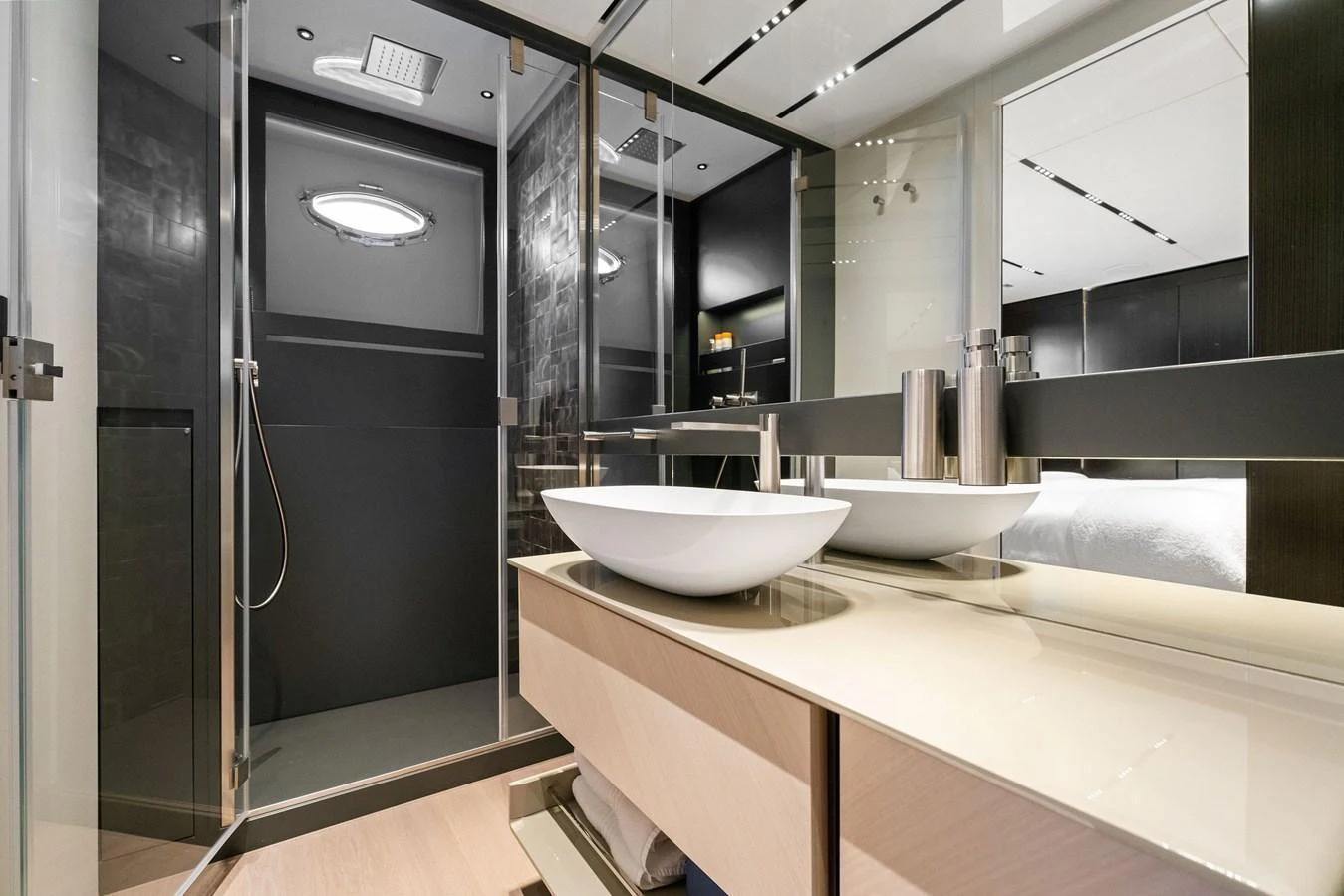 The yacht's bathroom features modern fixtures and a spacious shower area. aboard CAFFEINE Yacht for Sale